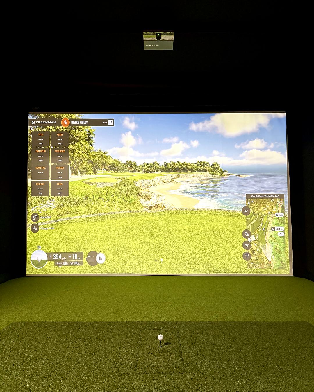 The Capital Golf Labs bay: a Trackman course on the impact screen with a ball teed up on the hitting mat